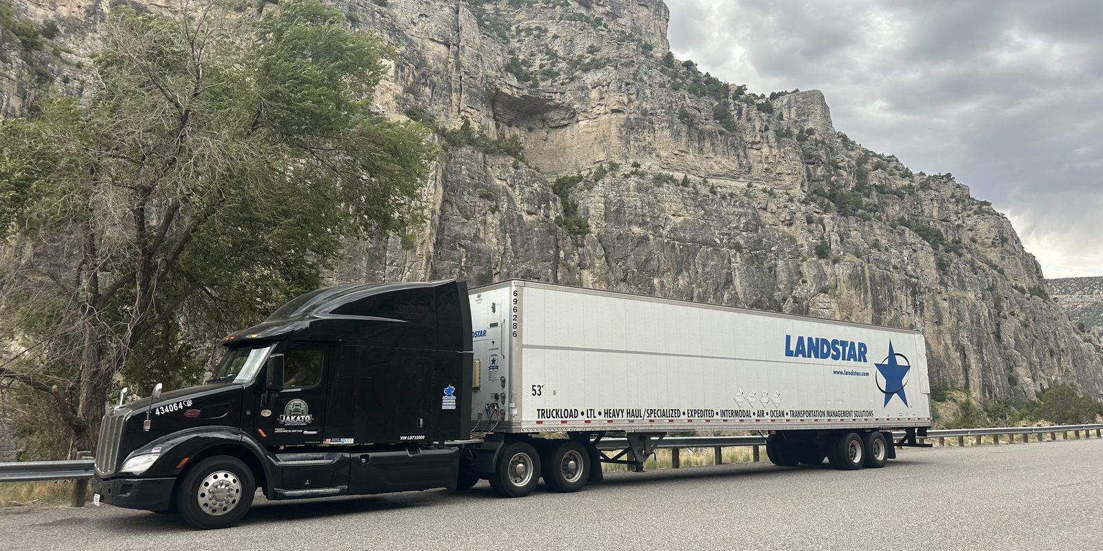 NorthStar, JAKATO's Peterbilt 579, parked below a rock face