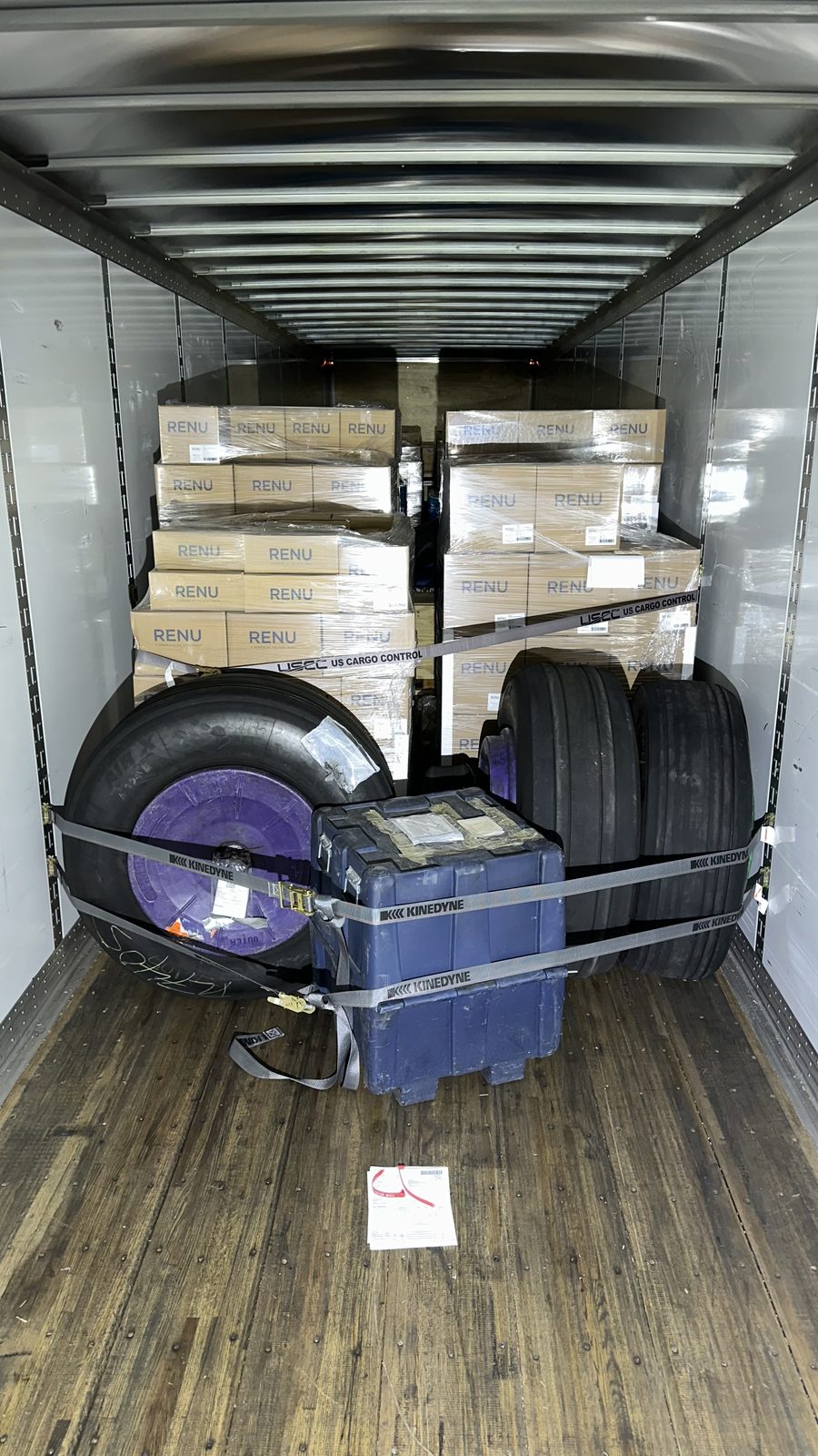 Van freight secured with high-visibility ratchet straps
